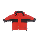 A kids' red and black ski jacket with a hood, featuring a snap button front, cordura lower back panel, and external pockets.
